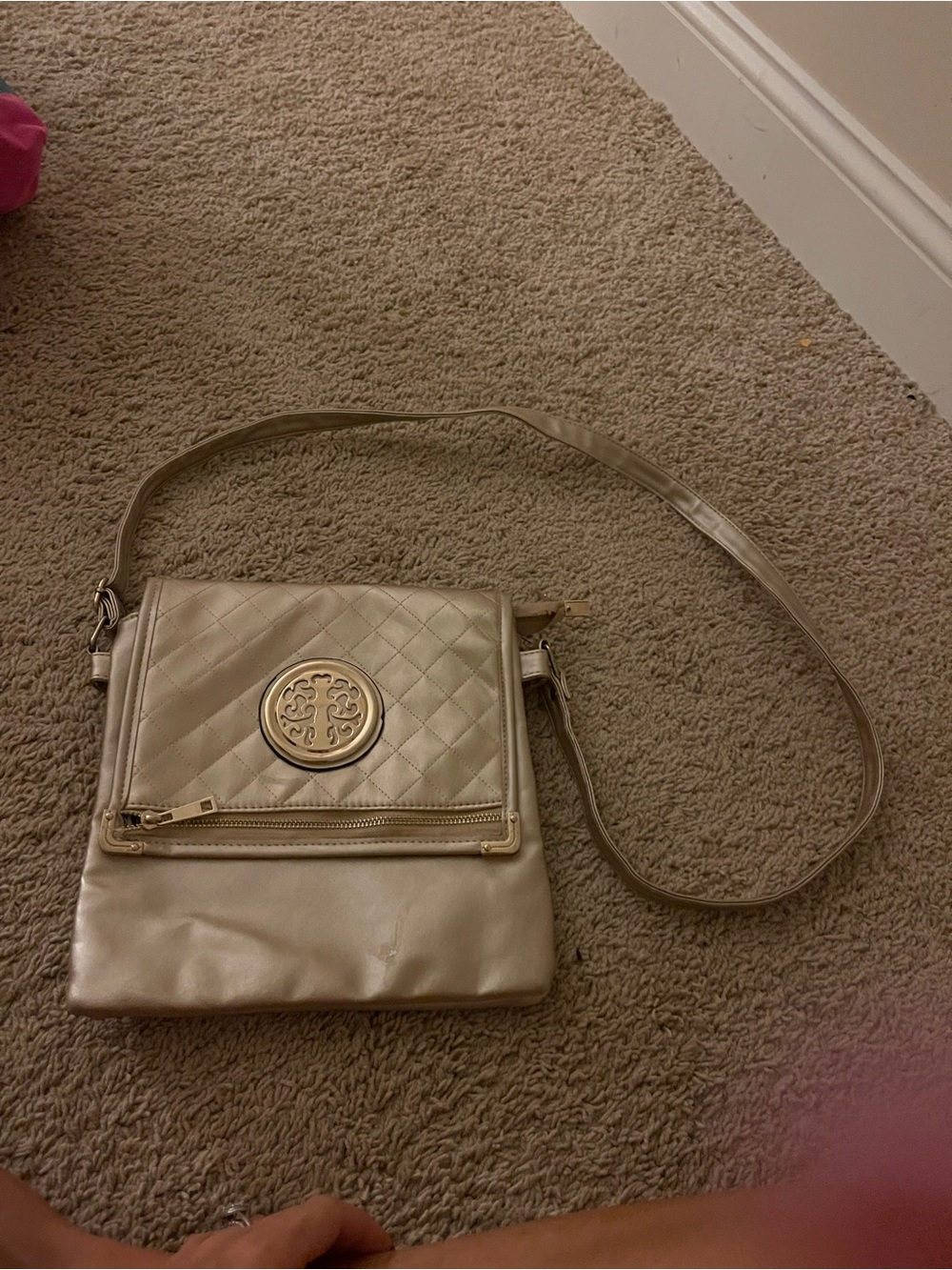 Quilted Metallic Cream Crossbody Bag with Decorative Medallion